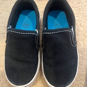Black and white slip ons. Toddler size 7